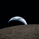 Earth rising over the moon's surface