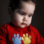 boy in red and blue crew neck long sleeve shirt